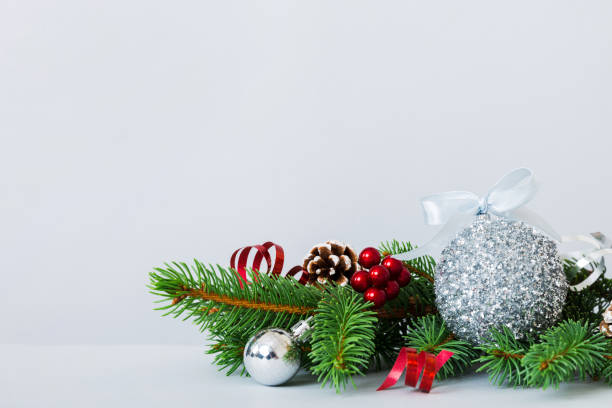 New Year Christmas tree toy, branches of a christmas tree, New Year decorations on a colored background