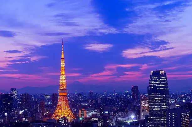 Evening shot of Tokyo skyline including both Tokyo Tower and Mt.Fuji in the background.