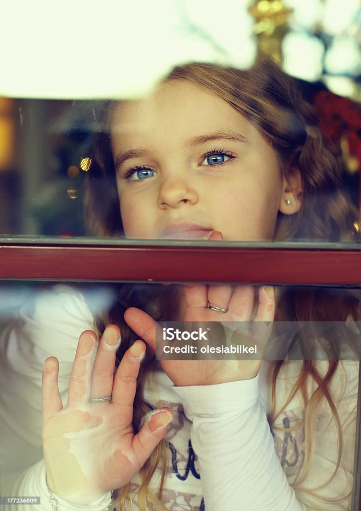 beautiful girl looking out the window. outside view Adult Stock Photo