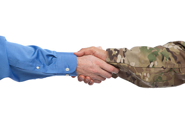Military and Businessman Handshake Caucasian businessman and Hispanic Military man shake hands navy photos stock pictures, royalty-free photos & images