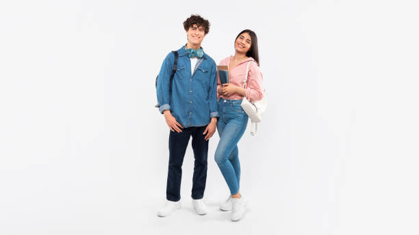 istock Students Couple Posing With Workbooks And Backpacks Standing Together, Studio 1772369945