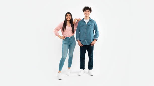 istock Happy Young Couple Posing Standing Over White Background, Full Length 1772369982