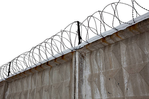 istock Razor Wire Above a Fence 177237078