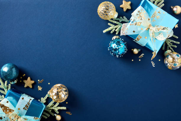 istock Christmas blue background with gift boxes and decorations in luxury style. Xmas greeting card template. 1772374562