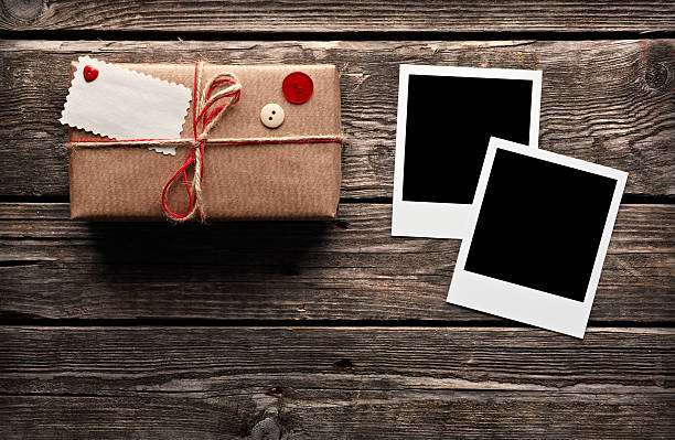 istock Photo frames with vintage gift box on wooden table. 177237513