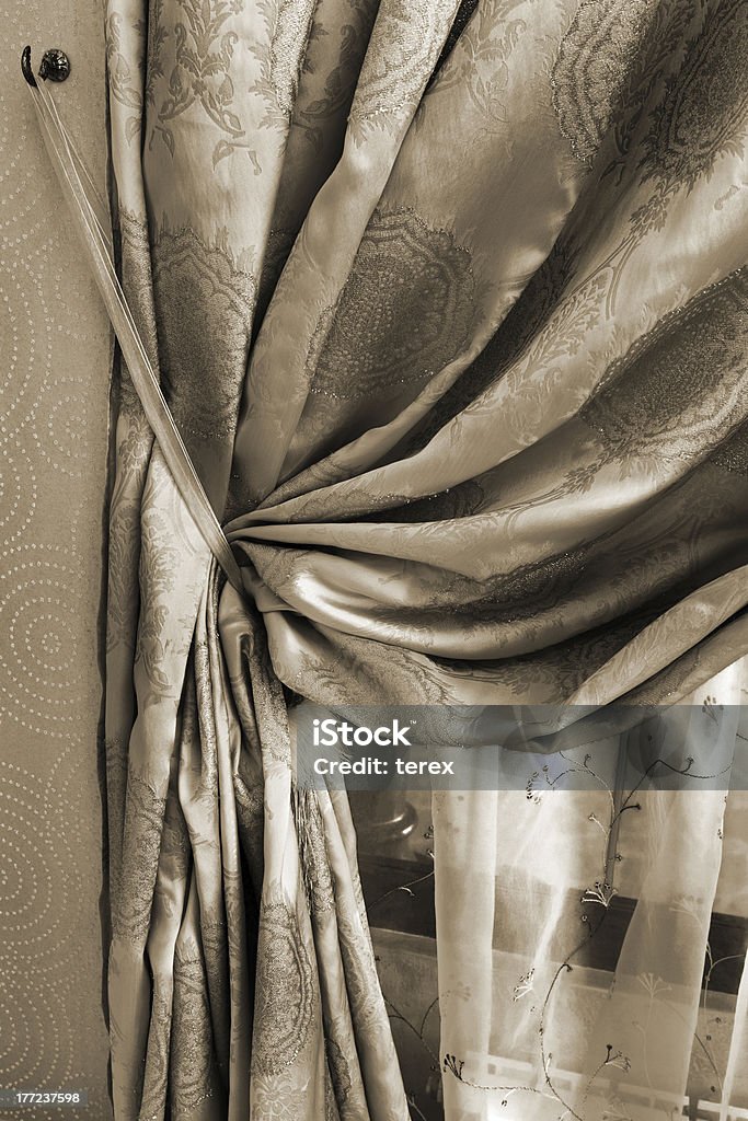 curtain with an ornament curtain with an ornament in the modern flat Brown Stock Photo