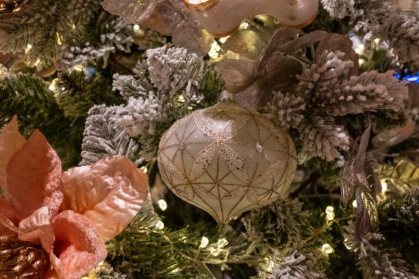 istock a christmas tree with ornaments on it and frosty needles 1772379581