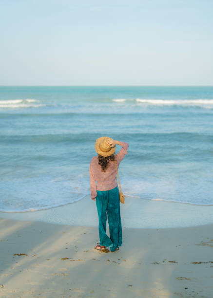 istock Woman walking on the beach during tropical vacation 1772379655