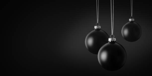 istock Black Christmas Baubles against a Black Background. Copy Space 1772379878