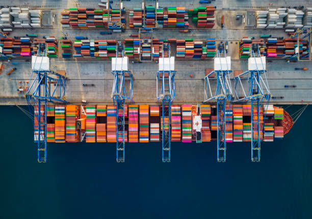 istock Aerial top down view of a large container cargo ship being unloaded by cranes 1772382047