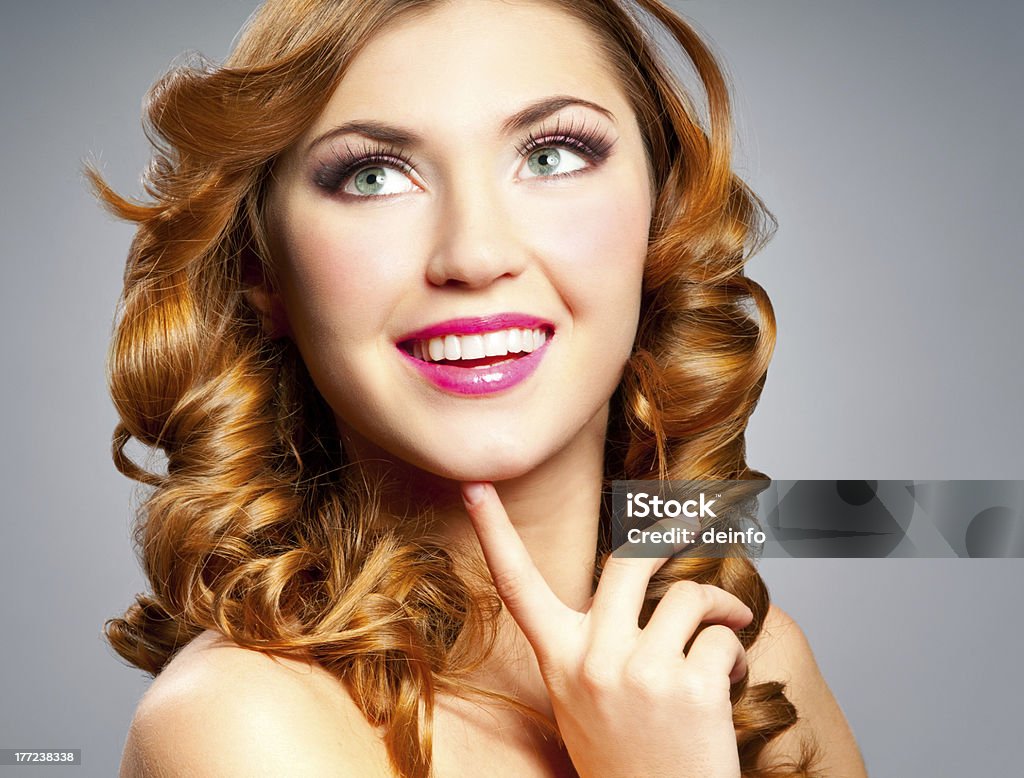 Woman with curly hair Beautiful happy woman with gold curly hair Adult Stock Photo