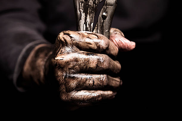 Dirty Hand Holding Wrench Mechanic holding a wrench in his dirty hands dirty hands stock pictures, royalty-free photos & images