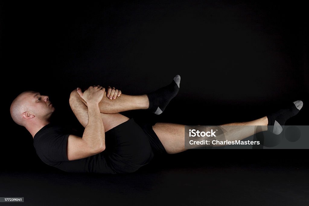 Posição de Pilates e alongamento de uma perna - Foto de stock de Adulto royalty-free