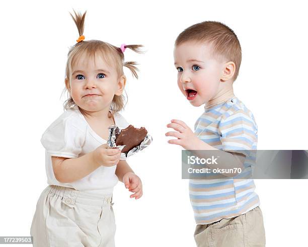 Funny Children Eating Chocolate On White Background Stock Photo - Download Image Now