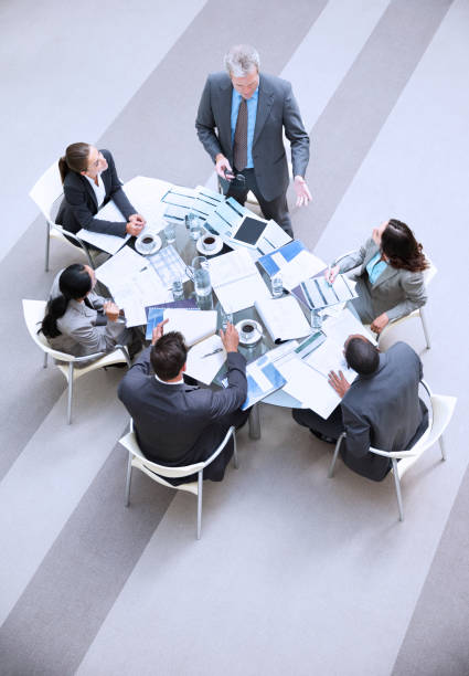 istock High angle view of businessman leading meeting 177240585