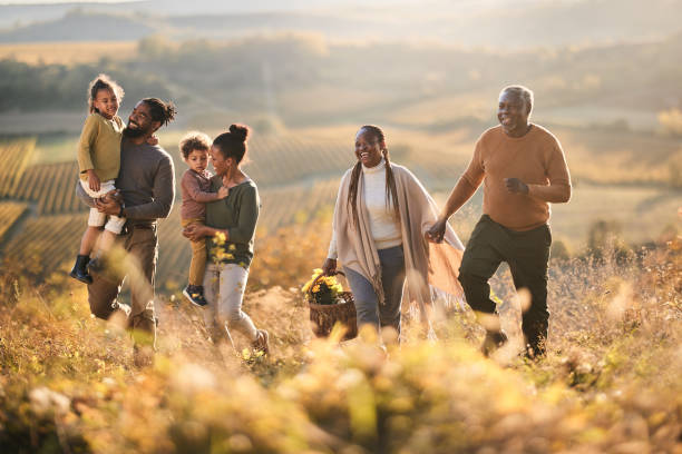 istock Happy black multi-generation family going on a picnic in autumn day. 1772406565