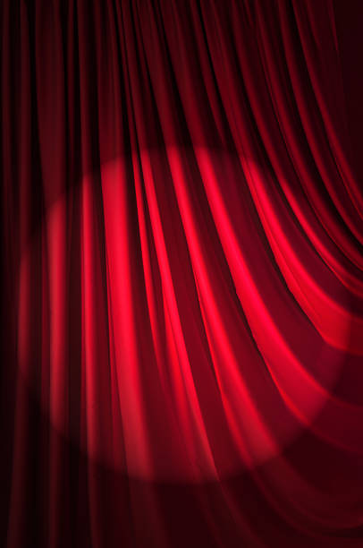 istock Brightly lit curtains in theatre concept 177240861