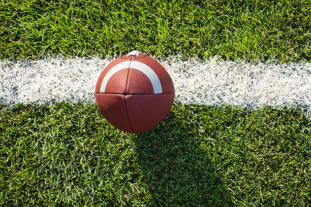 istock Top view football on yard line ready for kickoff 177241513