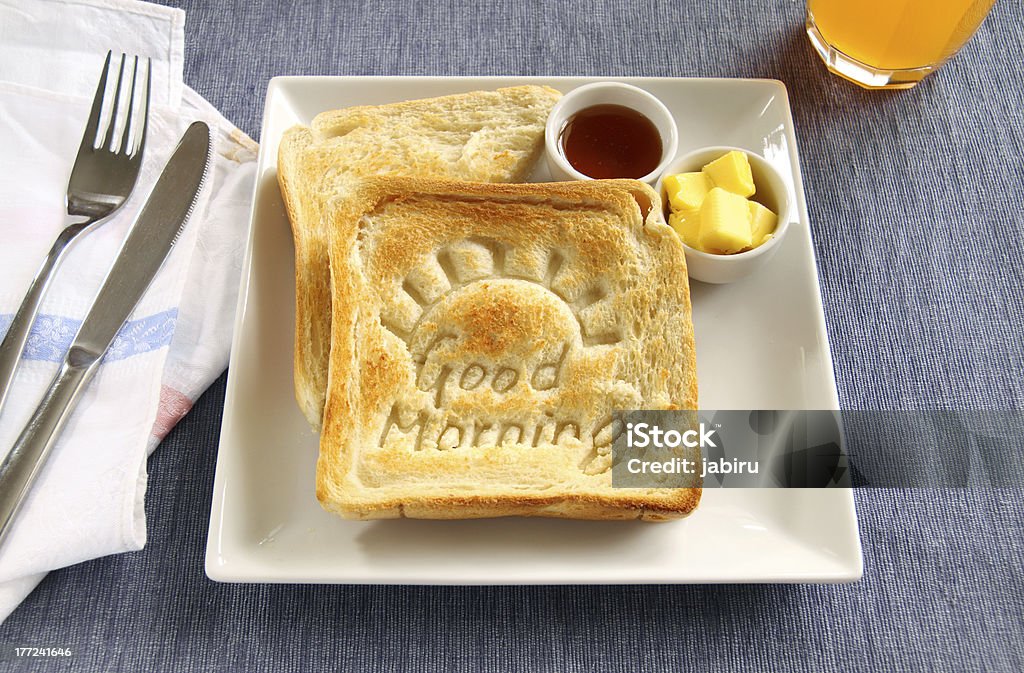 Good Morning Toast Slice of toast with Good Morning carved into it with butter and honey. Bread Stock Photo