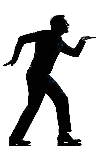 istock silhouette man funny egyptian walking full length 177241709