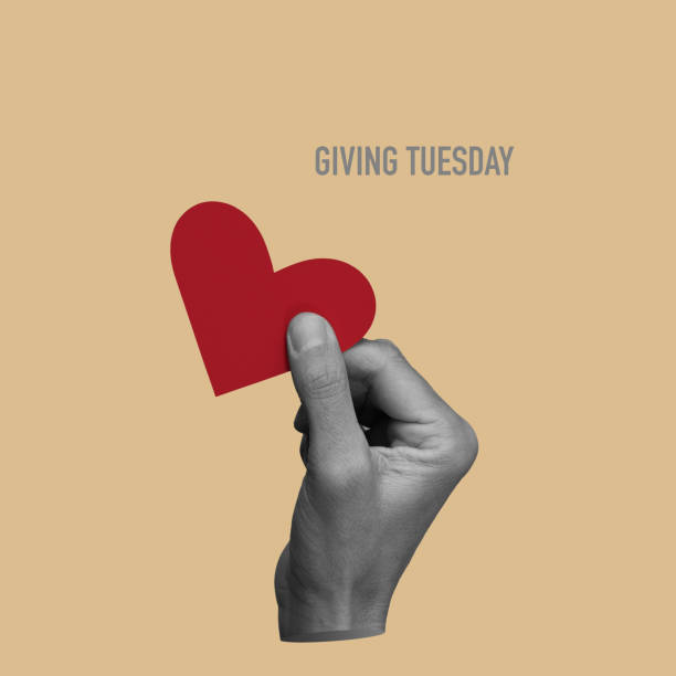 istock man with a red heart and text giving tuesday 1772417398