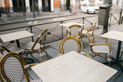 Cafe tables and chairs in a city street