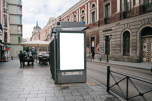 A bus stop with a blank advertisement billboard