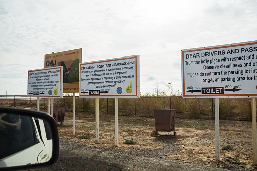 Aktau, Kazakhstan (Qazaqstan), 21.10.2023 - Information banners at the holy place Man Ata on the Atyrau-Aktau highway.