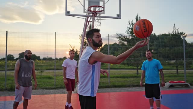 Basketball Player Spinning A Ball On The Court
