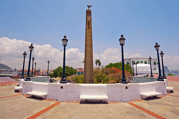 obelisk topped by a rooster, in Panama City "Originally Plaza de Francia was the main square of the city. This plaza is located at the very tip of the peninsula and in the center is an obelisk topped by a rooster, a symbol of the French nation. The 12 slabs of marble outline the history of the Panama Canal. All around are busts of Panamanian engineer Pero J. Sosa and French citizens (most of them were from France and French islands such as Guadeloupe or Martinique) who were prominent in the construction of the Canal. This impressive monument honors those 22,000 workers and engineers who died (due to Yellow Fever & Malaria) trying to build the canal. ." casco viejo photos stock pictures, royalty-free photos & images