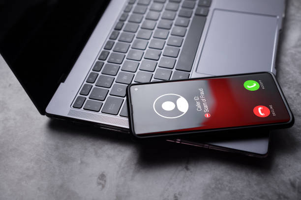 istock Smartphone laying on laptop while reciving unwanted call. 1772428231