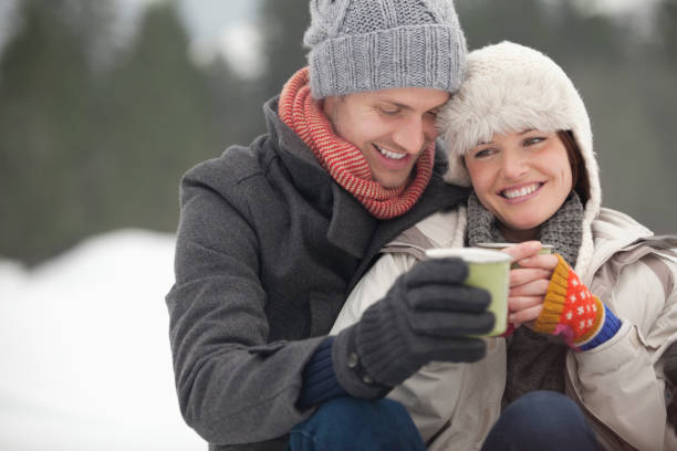 istock Happy couple drinking coffee in snow 177242999