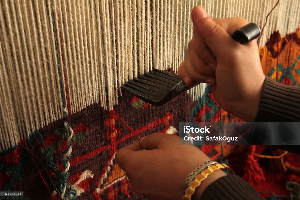 Close-up of a woman hand-weaving a colorful rug Rug Rug Stock Photo