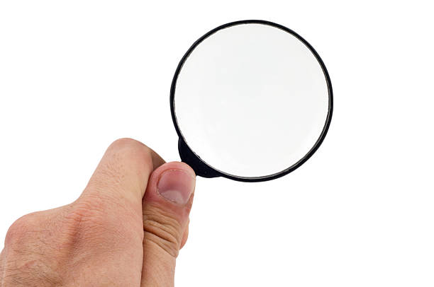 istock Magnifying  Glass on the Male Hand 177243375