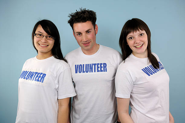 istock Group of three young volunteers 177243401