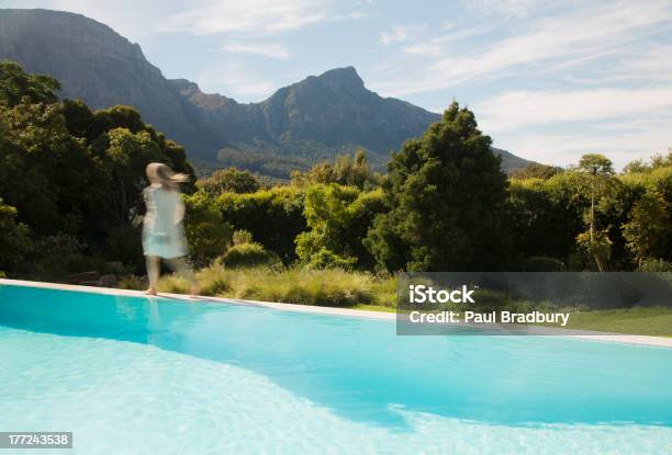 Woman Walking Along Swimming Pool Stock Photo - Download Image Now - Swimming Pool, One Person, Rear View
