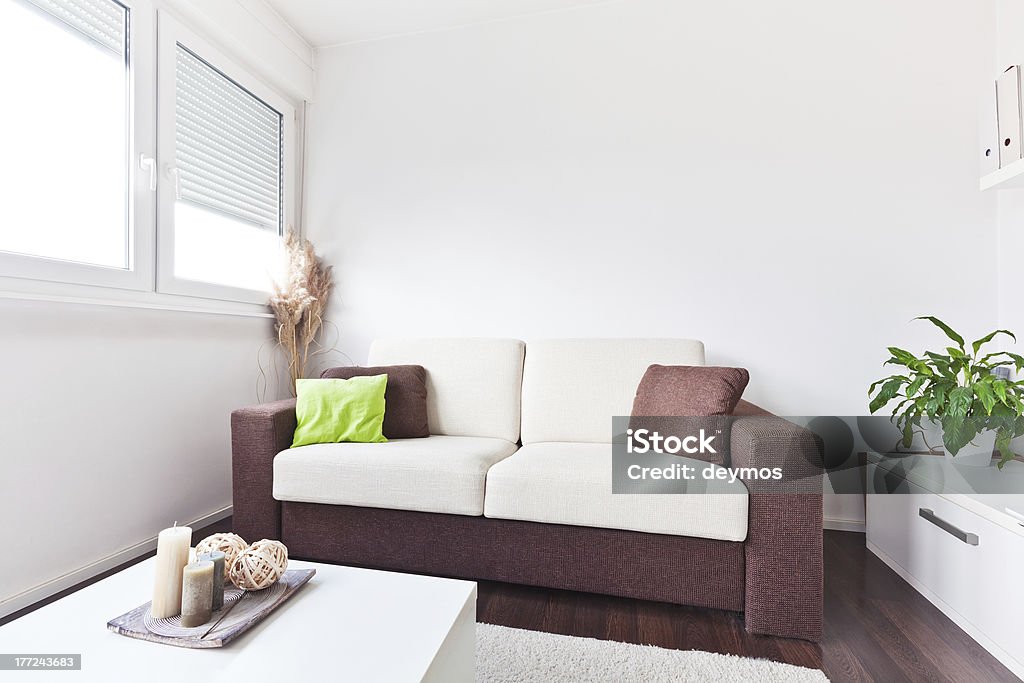 White and brown fabric sofa in the living room White and brown fabric sofa in the living room with brown cushions Apartment Stock Photo