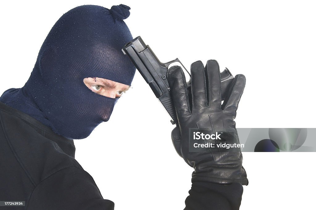 Masked terrorist with gun - isolated on white Masked terrorist with gun - isolated on whiteSimilar images: Adult Stock Photo