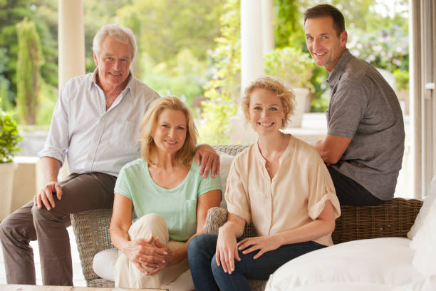 istock Portrait of smiling couples on patio 177244480