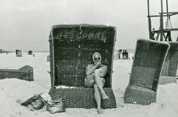 Vintage photo of woman in beach basket stock photo