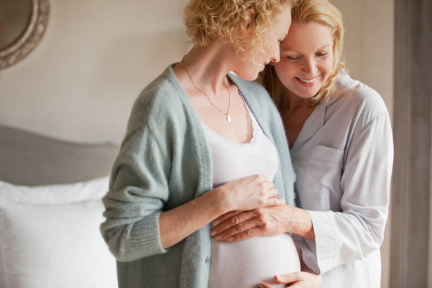 istock Mother holding pregnant daughter's stomach 177244603