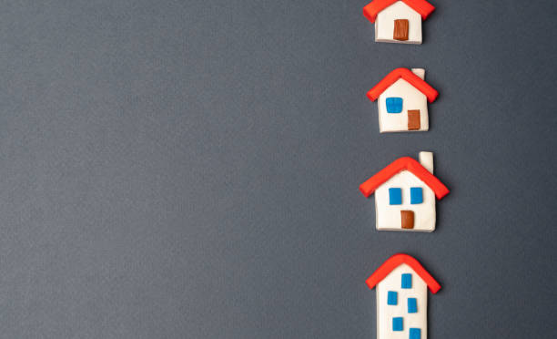 istock Houses figurines in a row. 1772449001
