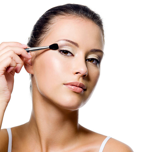 istock woman applying eyeshadow with brush 177244970