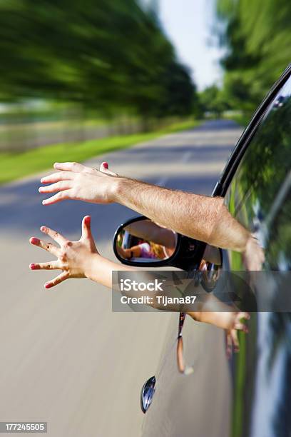 Two Arms Sticking Out Of The Car Stock Photo - Download Image Now - Family, Car, Road Trip