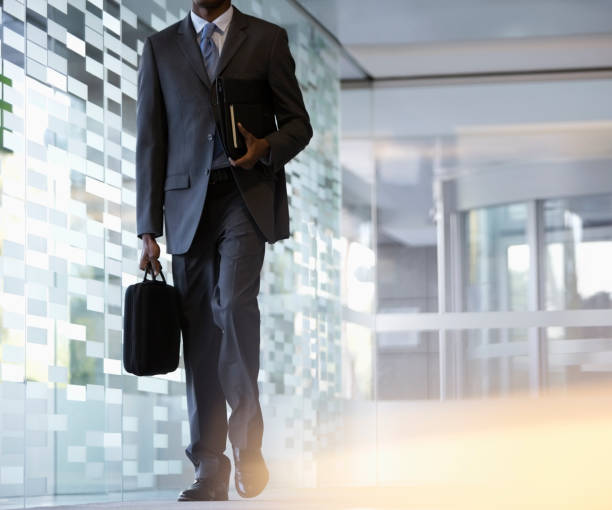 istock Businessman carrying briefcase in lobby 177245580