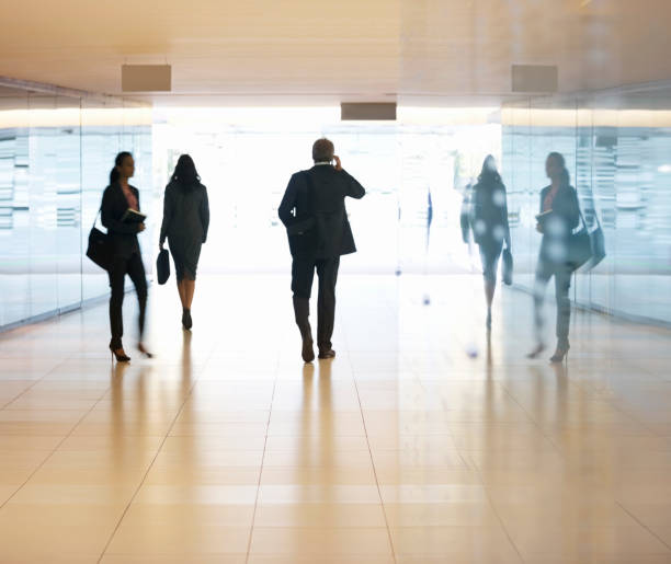 istock Business people walking in lobby 177245917