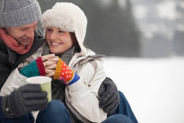 istock Happy couple drinking coffee in snow 177246138