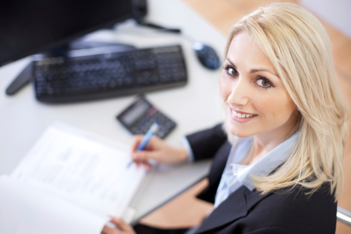 Beautiful businesswoman doing finances