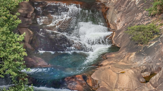 The water rushes down the base of the gorge at Tallulah Gorge State Park in Tallulah Falls, Georgia.