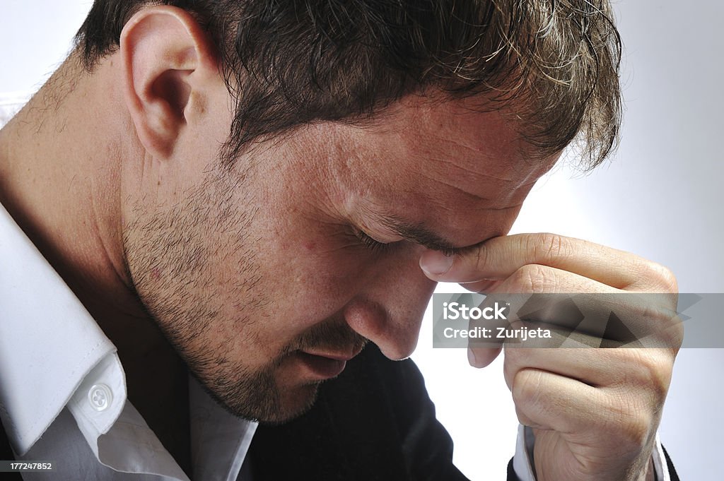Depressed stressed man "Young man in pose, stress, migraine, headache" Adult Stock Photo